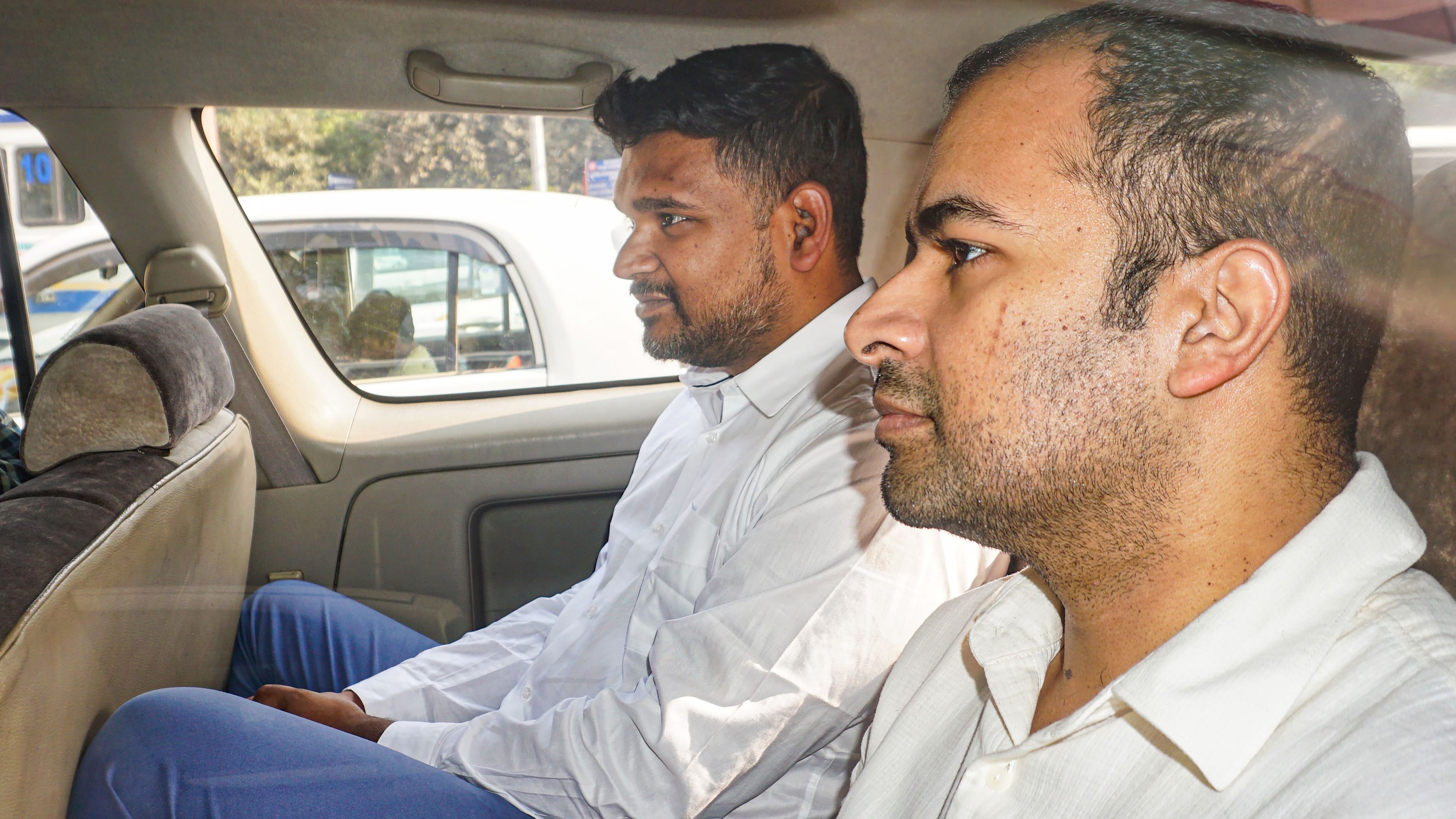 <div class="paragraphs"><p>Businessman Abhishek Boinpally (R) and AAP leader &amp; businessman Vijay Nair being produced before a court for the hearing of the alleged Delhi excise policy scam case, in New Delhi. </p></div>