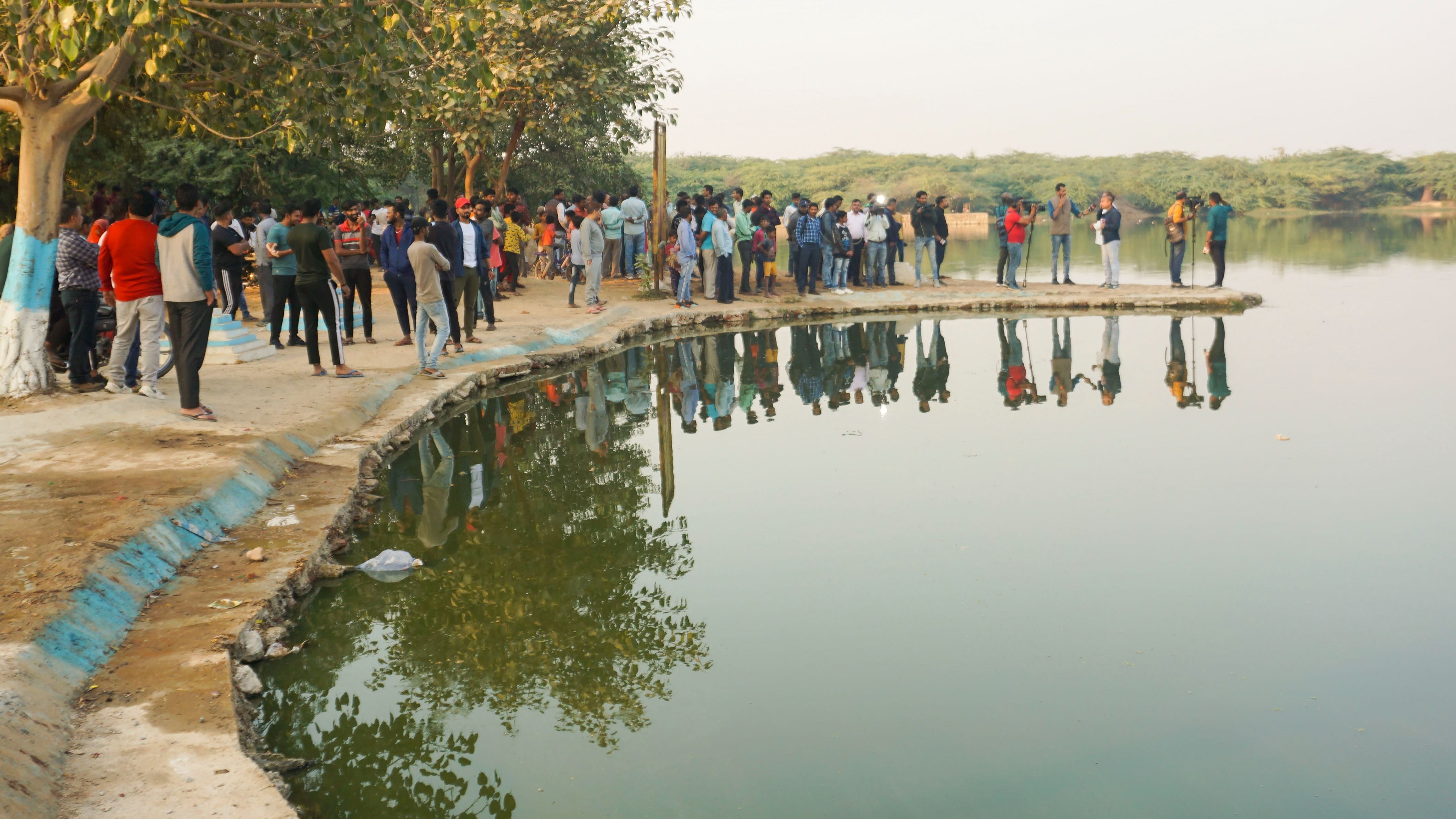 The police team also went to a pond in Maidangarhi to search for remains after its water level was reduced. Credit: PTI Photo