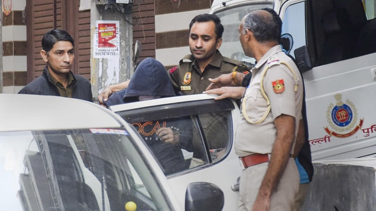 Aftab Poonawalla, accused of killing his partner Shraddha Walkar, being brought to his residence at Chhatarpur as part of the ongoing investigation. Credit: PTI Photo