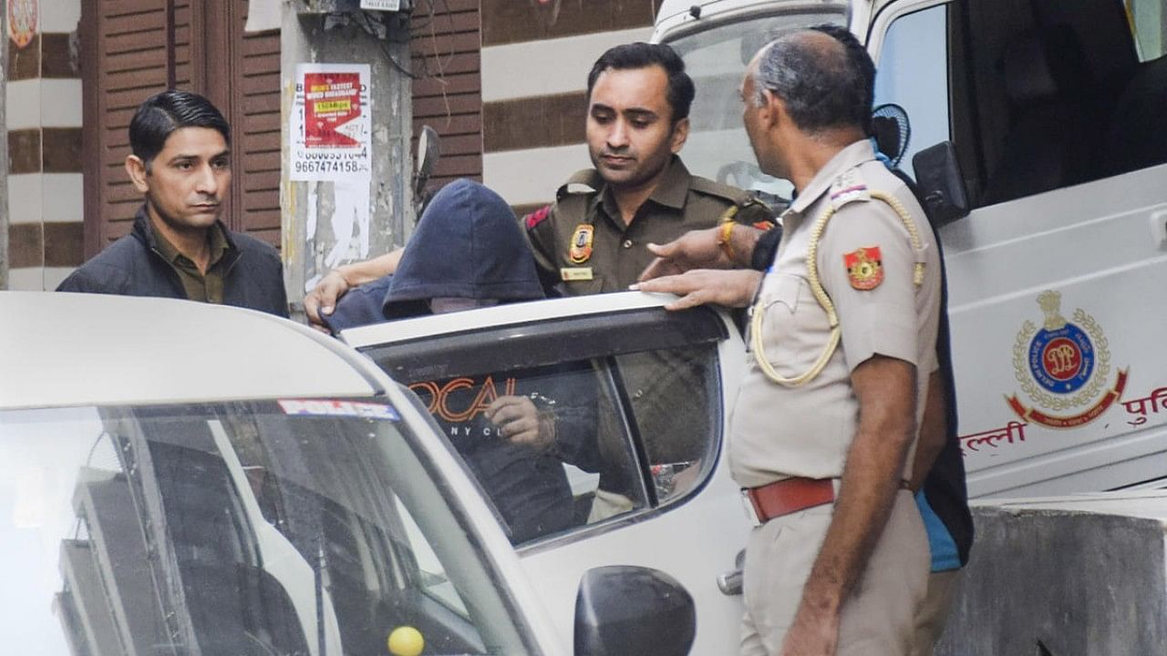 Aftab Poonawalla, accused of killing his partner Shraddha Walkar, being brought to his residence at Chhatarpur as part of the ongoing investigation. Credit: PTI File Photo