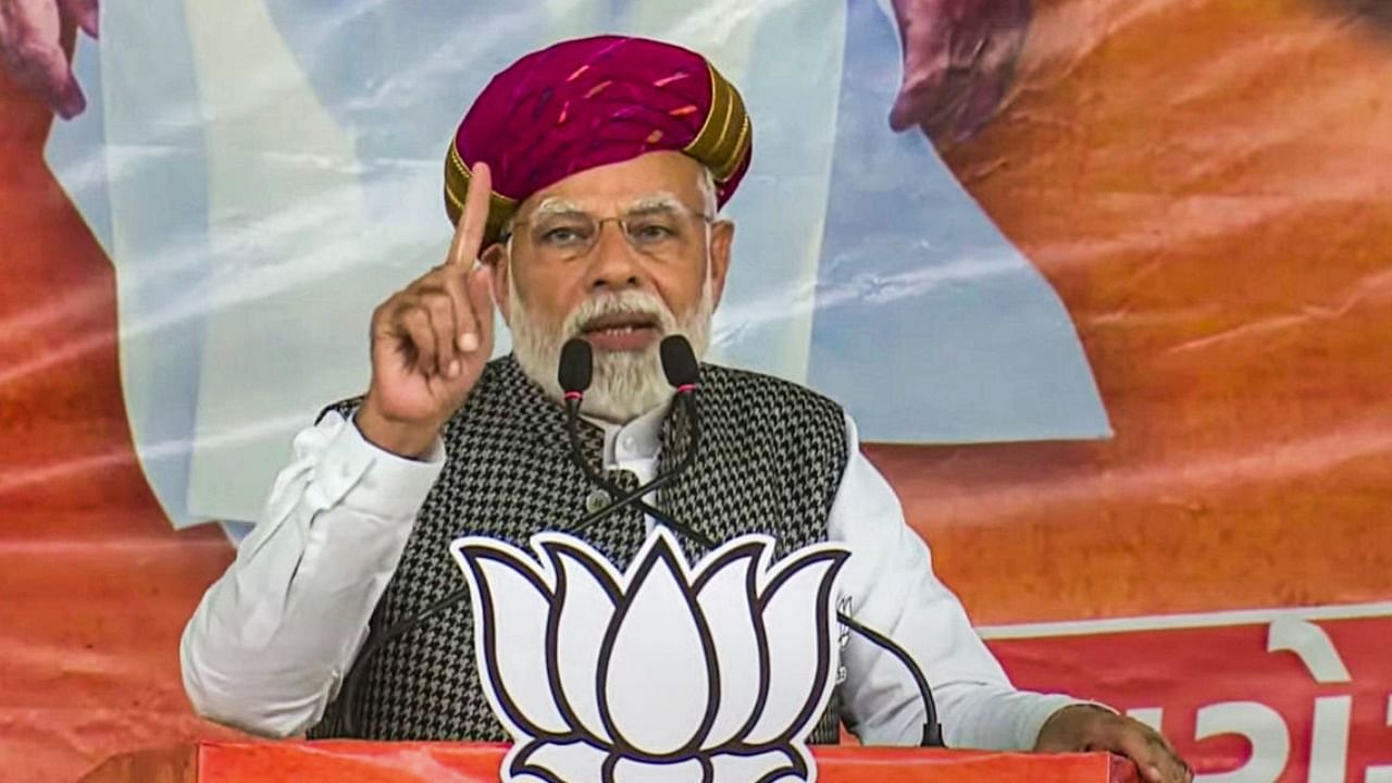 PM Narendra Modi speaks during a public meeting ahead of the Gujarat Assembly elections, in Surendranagar. Photo Credit: PTI Photo