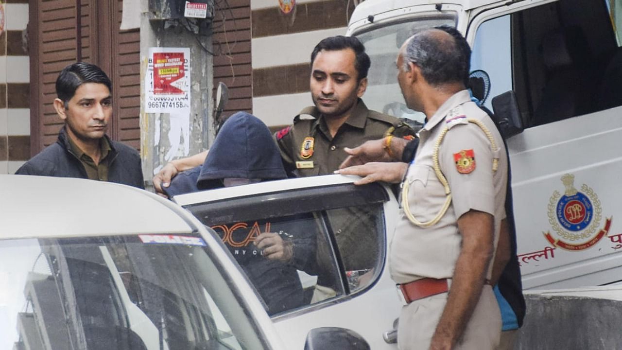 Aftab Poonawala being brought to his residence in Chattarpur as part of probe. Photo Credit: PTI Photo