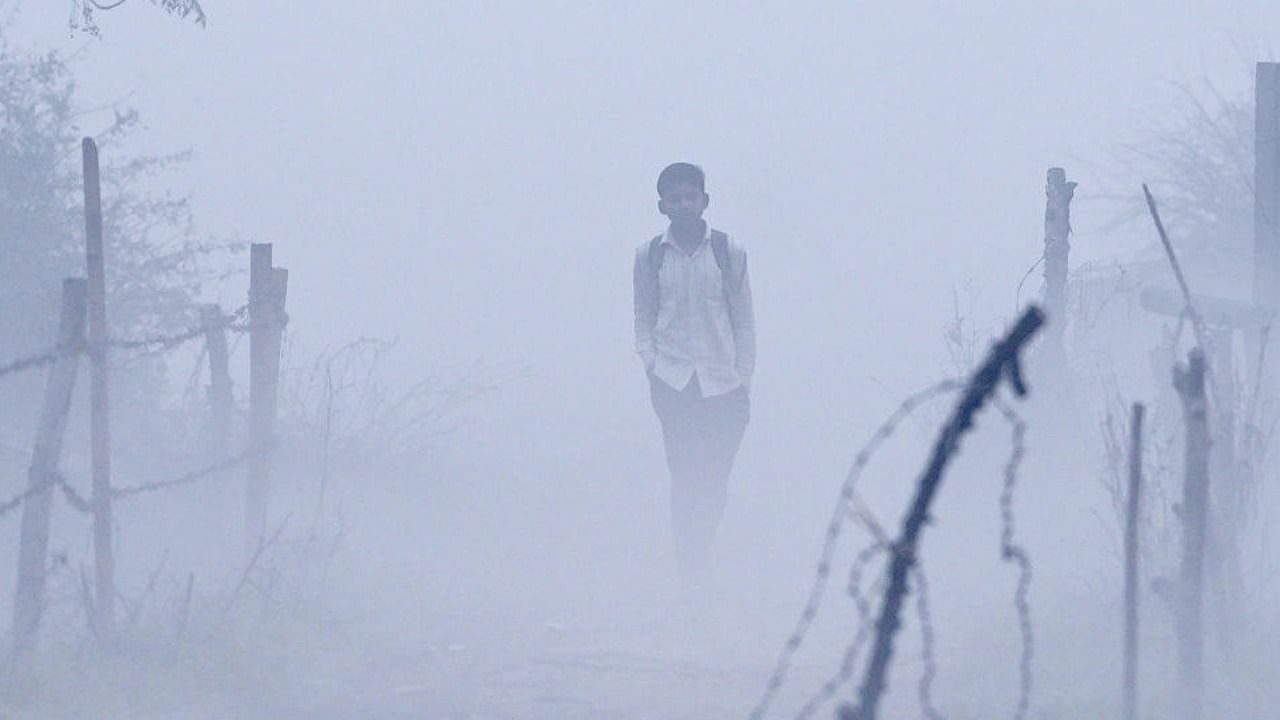  A student walks in an open field area shrouded in smog in New Delhi, Tuesday, Nov. 8, 2022. Credit: PTI Photo
