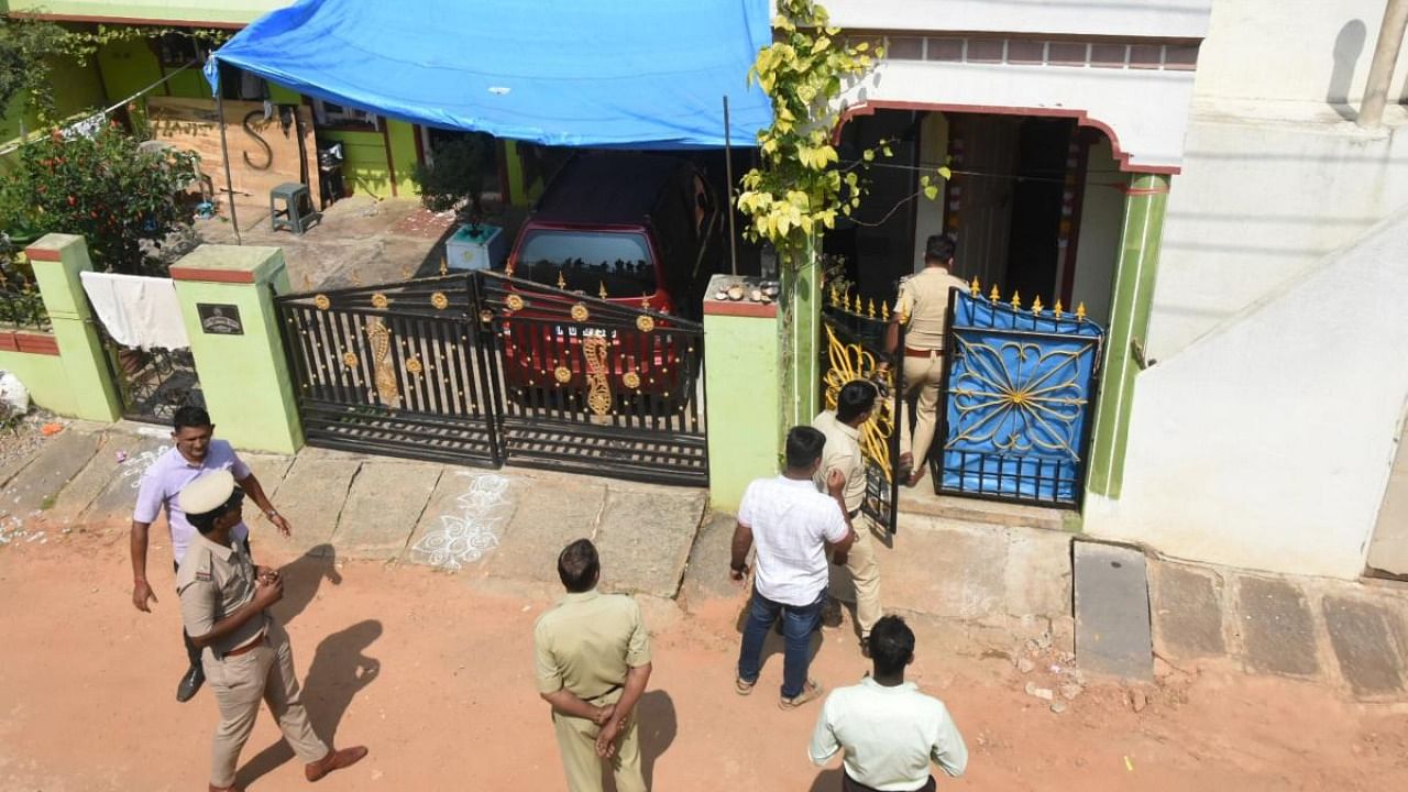 Police investigate at the residence of the accused involved in an explosion in an auto-rickshaw in Mangaluru. Credit: PTI Photo
