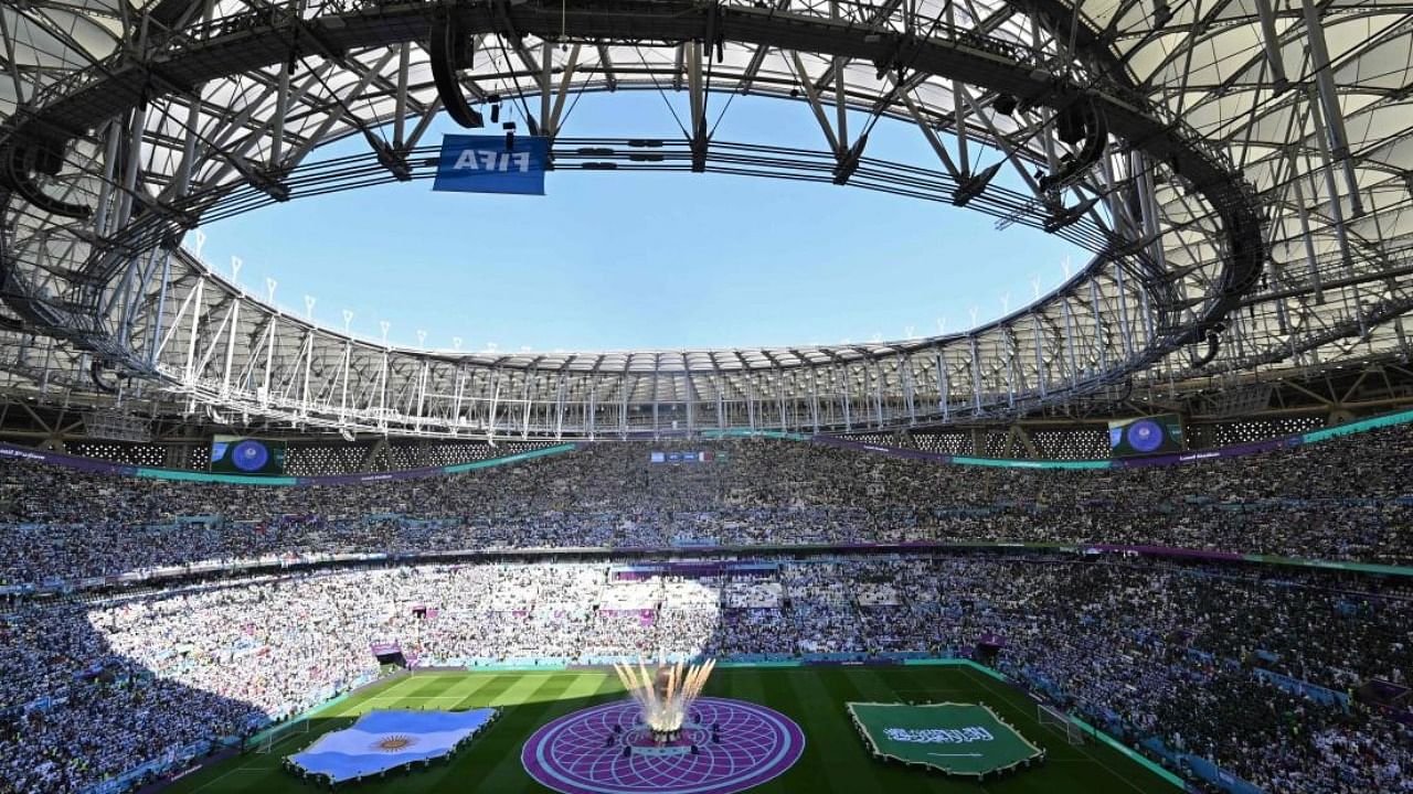 A replica of the FIFA World Cup trophy is pictured on the pitch ahead of Group C football match between Argentina and Saudi Arabia. Photo Credit: AFP
