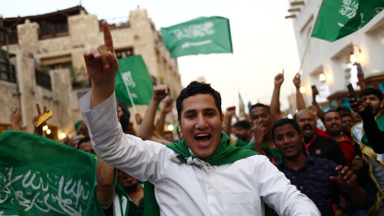 Saudi Arabia fans celebrate in Souq Waqif after the match between Saudia Arabia and Argentina. Credit: Reuters Photo