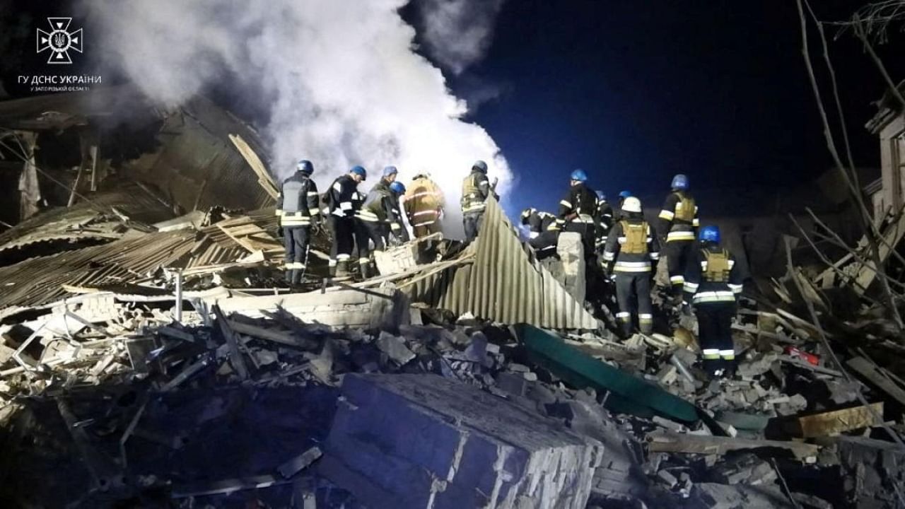 Rescuers work at the site of a maternity ward of a hospital destroyed by a Russian missile attack in Vilniansk. Credit: State Emergency Service of Ukraine/Handout via Reuters
