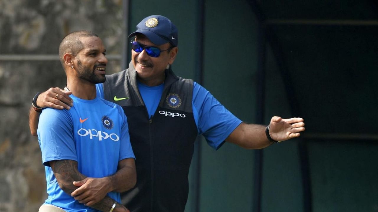 Shikhar Dhawan and Ravi Shastri during a practice session. Credit: AFP Photo