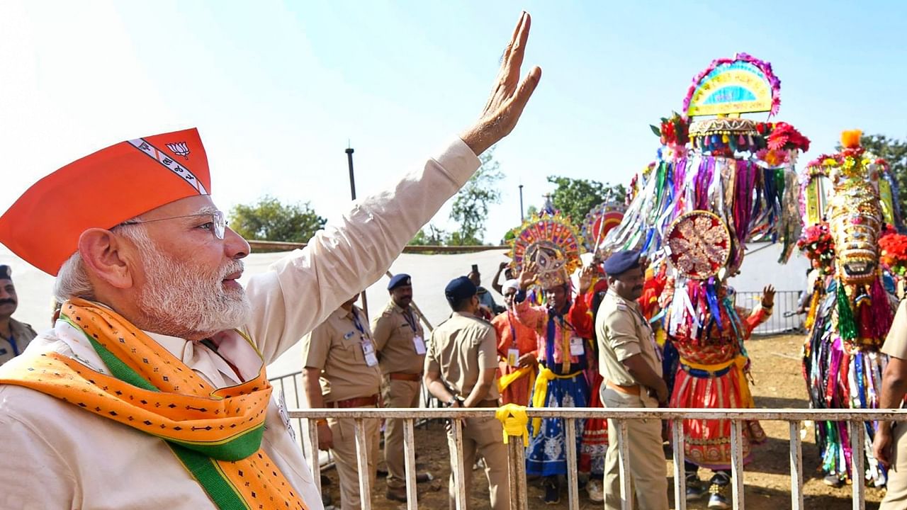 Prime Minister Narendra Modi waves at supporters during a public meeting at Kaprada in Valsad district, Gujarat, Sunday, Nov. 6, 2022. Credit: PTI Photo