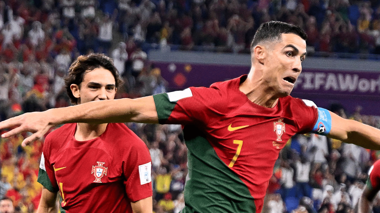 Portugal's forward #07 Cristiano Ronaldo (2nd L) celebrates scoring his team's first goal from a penalty shot during the Qatar 2022 World Cup. Credit: AFP Photo