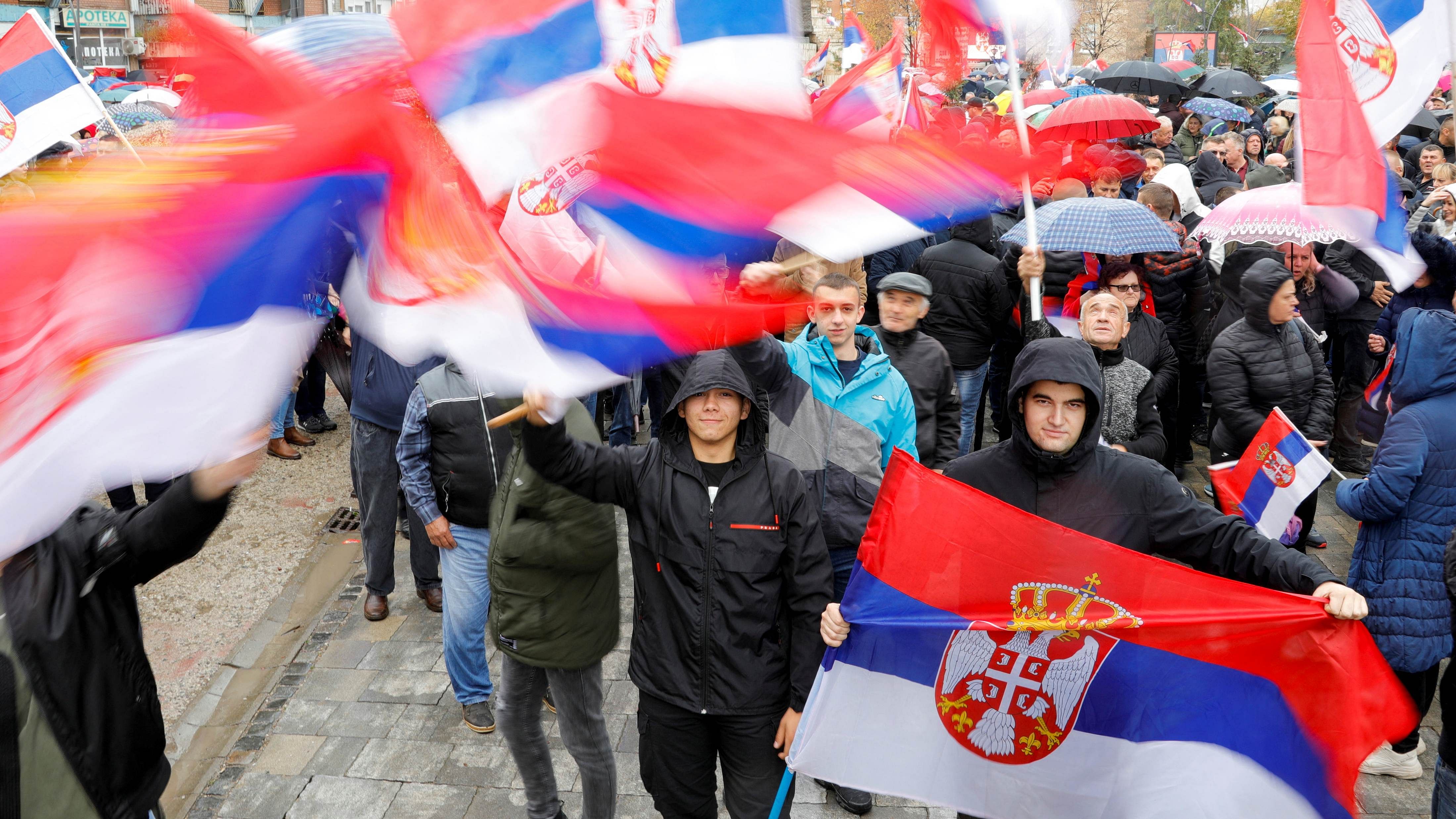 People wave Serbian flags as they protest following local Serbs' decision to leave Kosovo institutions. Credit: Reuters Photo