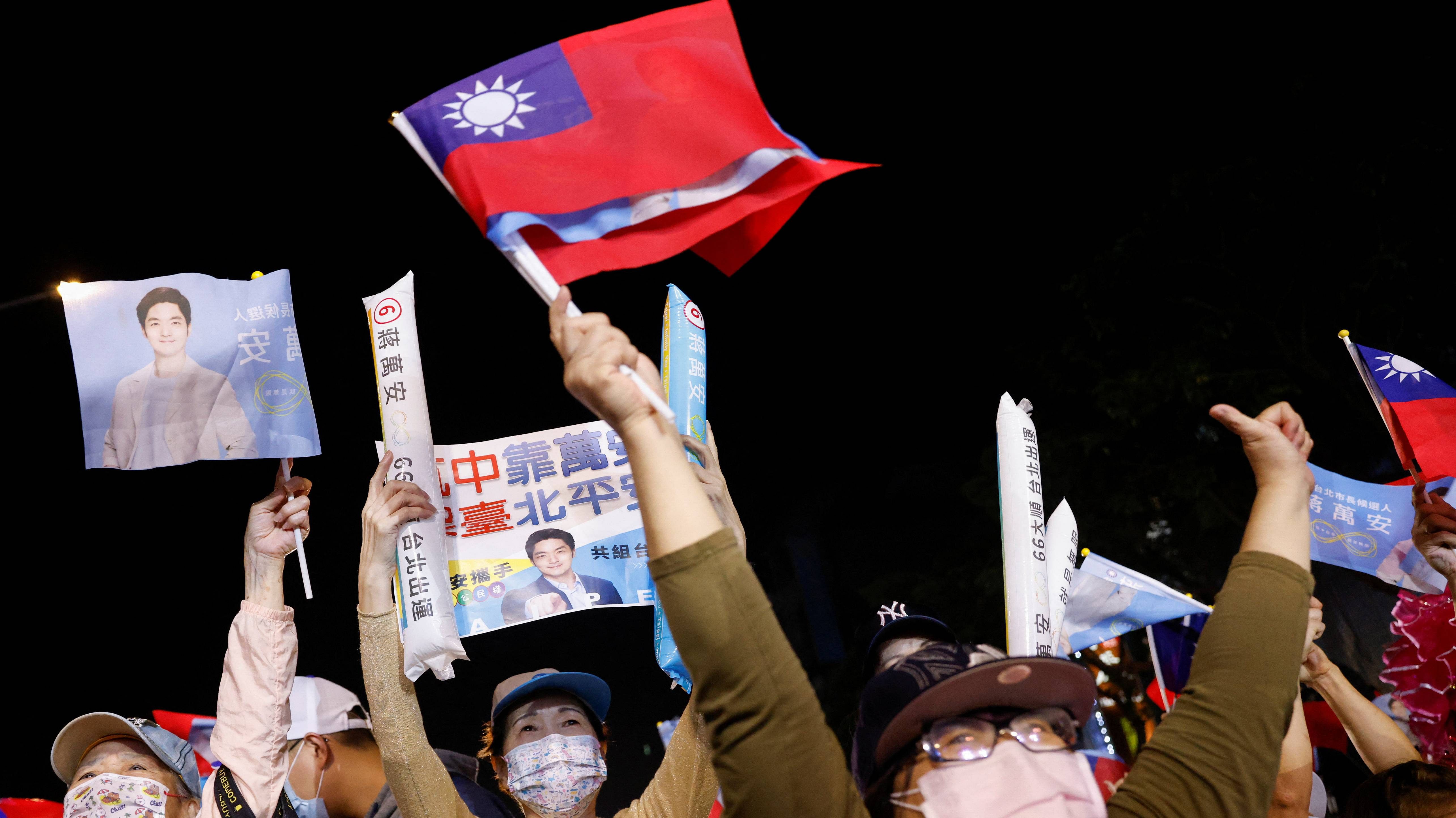 Supporters of the opposition party Kuomintang (KMT) celebrate the preliminary results of the local elections during a rally in Taiwan. Credit: Reuters Photo