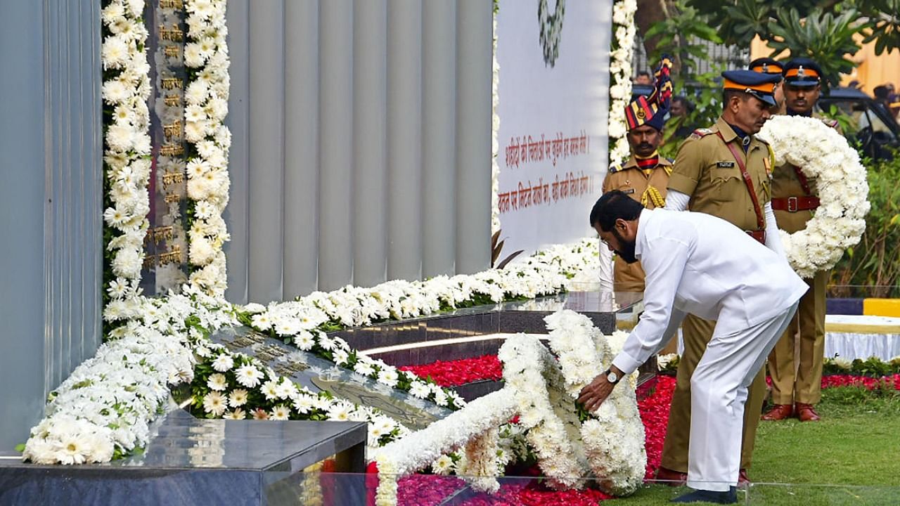  Maharashtra CM Eknath Shinde pays homage at the Police Memorial on the occasion of the 14th anniversary of the 26/11 Mumbai terror attack. Credit: PTI Photo
