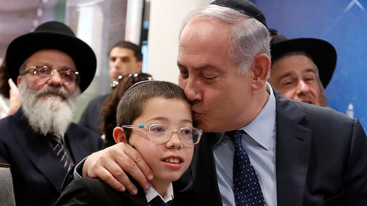 Benjamin Netanyahu kisses Moshe Holtzberg, who survived during the 2008 Mumbai attacks. Photo Credit: Reuters