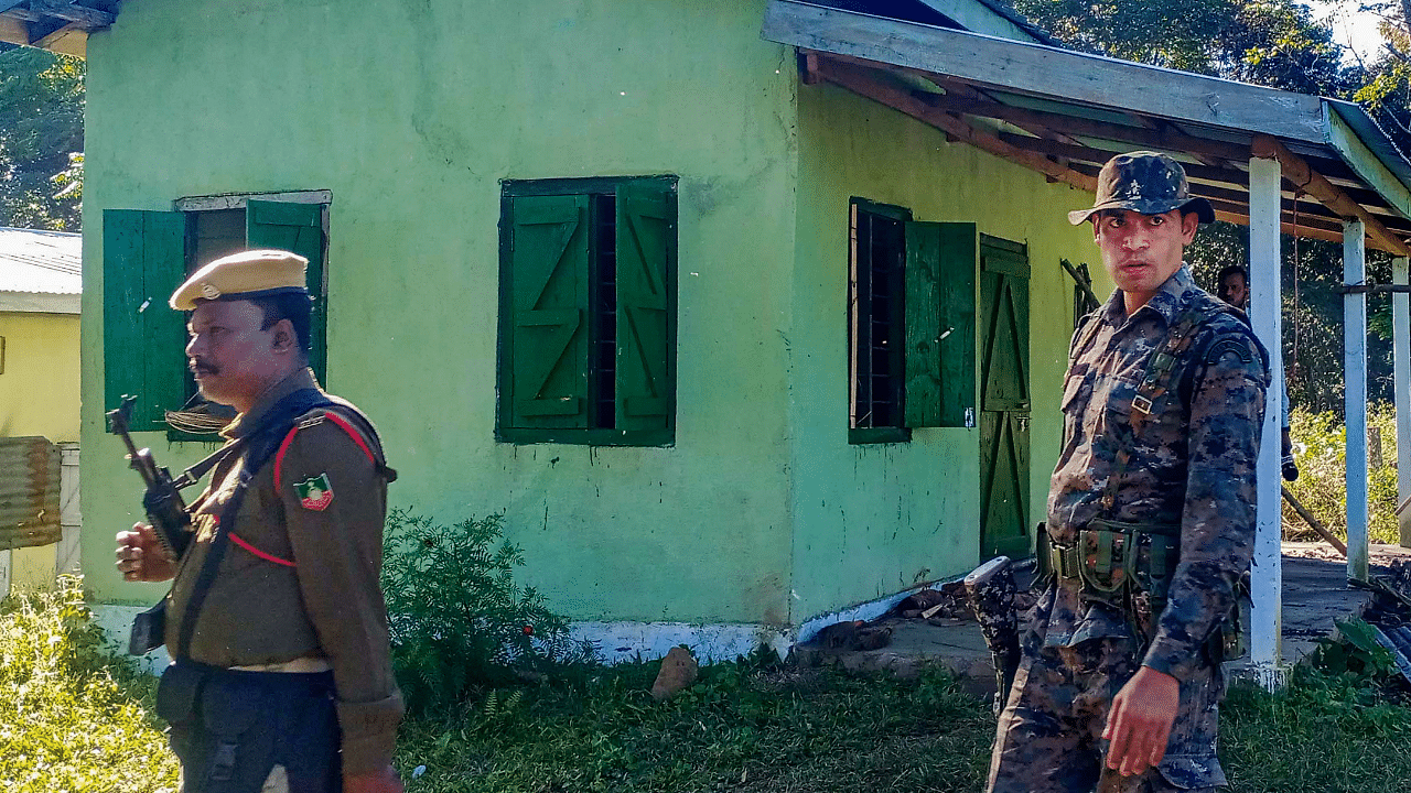 Security personnel stand guard following violence at a disputed Assam-Meghalaya border location that killed six people, in West Karbi Anglong district. Credit: PTI Photo