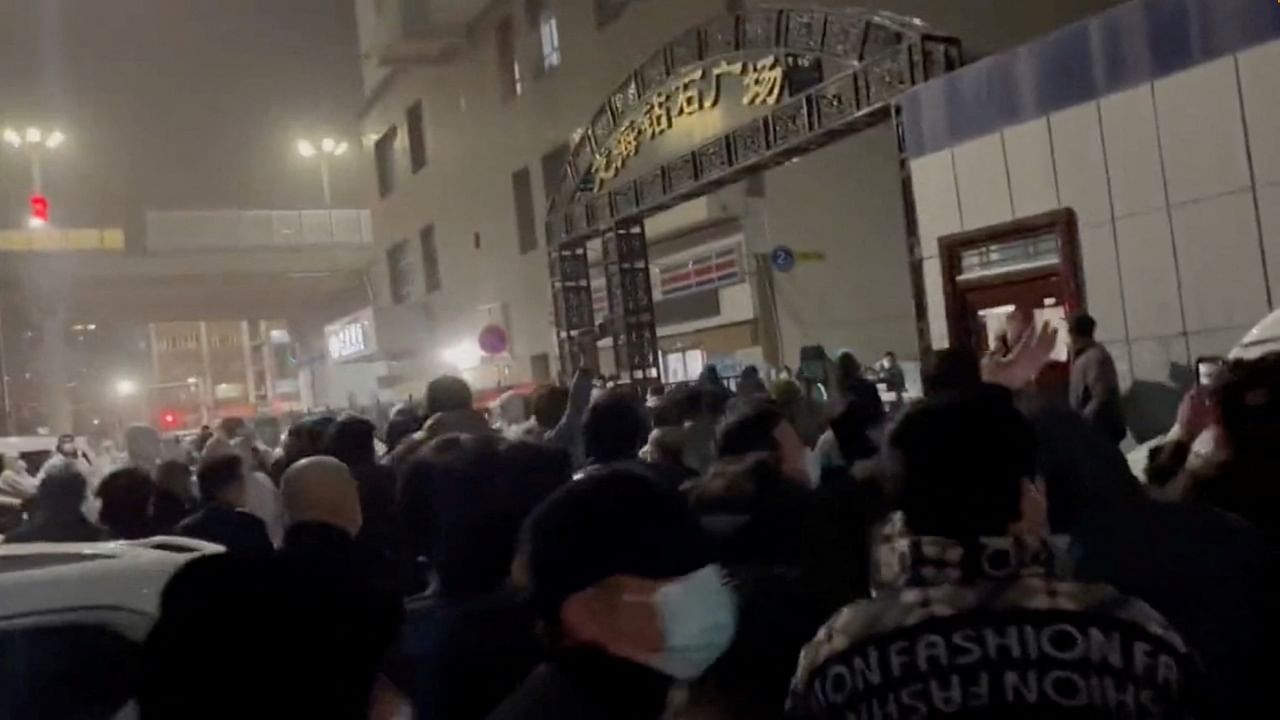 Some videos appeared to show crowds of people taking to the streets of Urumqi to protest against the measures. Credit: Reuters Photo