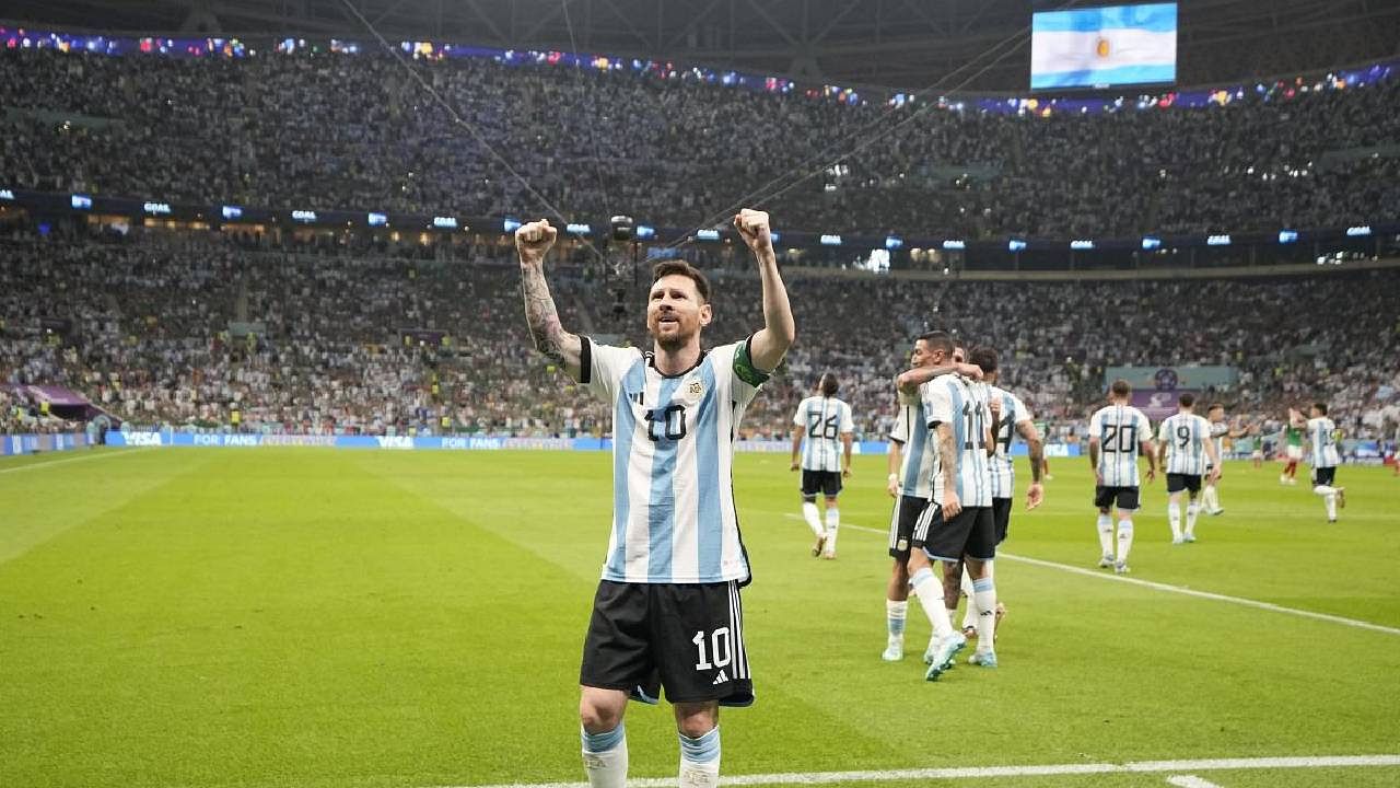 Argentina's Lionel Messi celebrates after scoring his side's opening goal during the World Cup group C soccer match between Argentina and Mexico. Credit: AP/PTI Photo