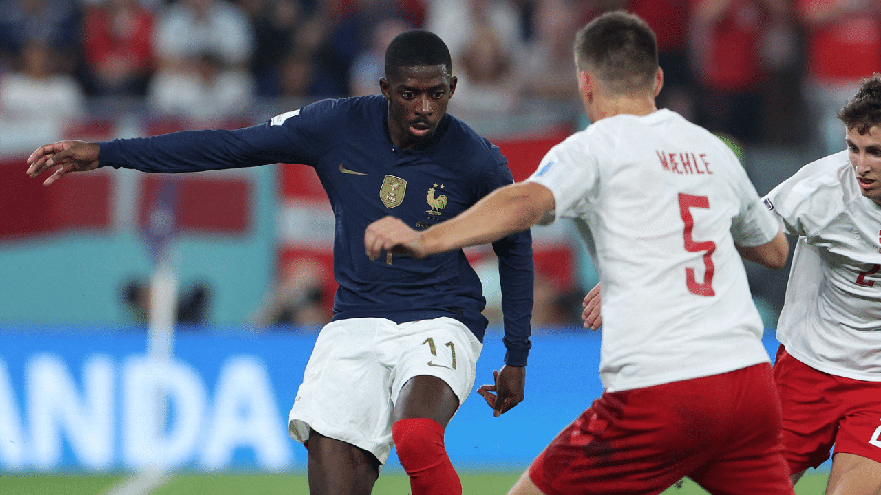 France's forward #11 Ousmane Dembele fights for the ball with Denmark's defender #05 Joakim Maehle. Credit: AFP Photo