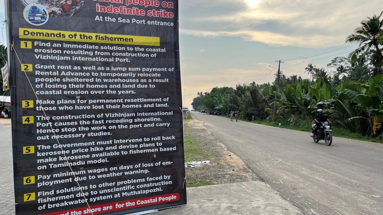 A placard featuring the demands of protesting fishermen near the entrance of the proposed Vizhinjam Port. Credit: Reuters Photo