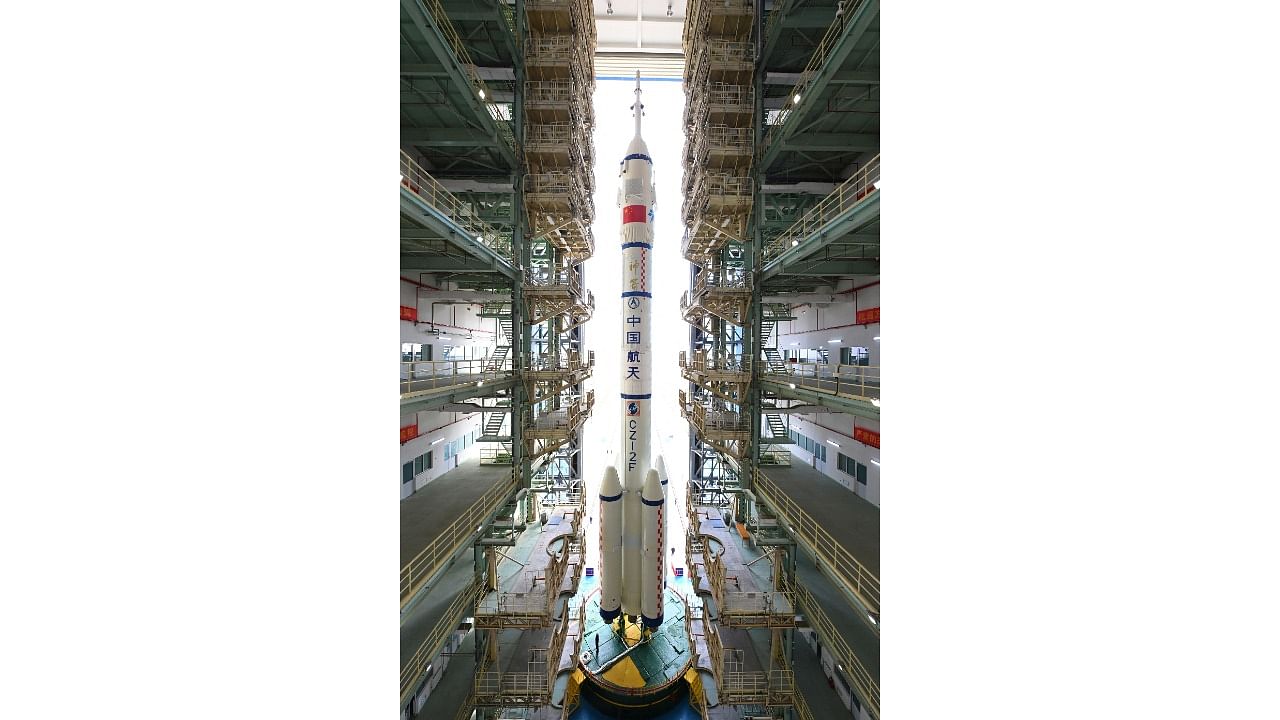 Long March-2F rocket, carrying the Shenzhou-15 spacecraft, is transferred to the launching area at Jiuquan Satellite Launch Center. Credit: Reuters Photo
