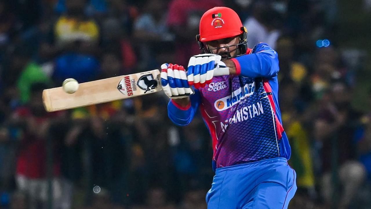 Afghanistan's Mohammad Nabi plays a shot during the second one-day international (ODI) cricket match between Sri Lanka and Afghanistan at the Pallekele International Cricket Stadium in Kandy on November 27, 2022. Credit: AFP Photo