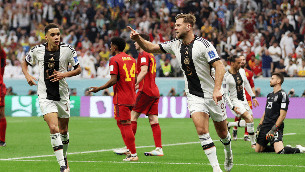 Germany's Niclas Fullkrug celebrates scoring their first goal with Jamal Musiala. Credit: Reuters Photo