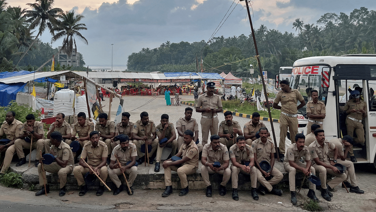 Police officers are deployed as fishermen protest near the entrance of the proposed Vizhinjam Port. Credit: Reuters Photo