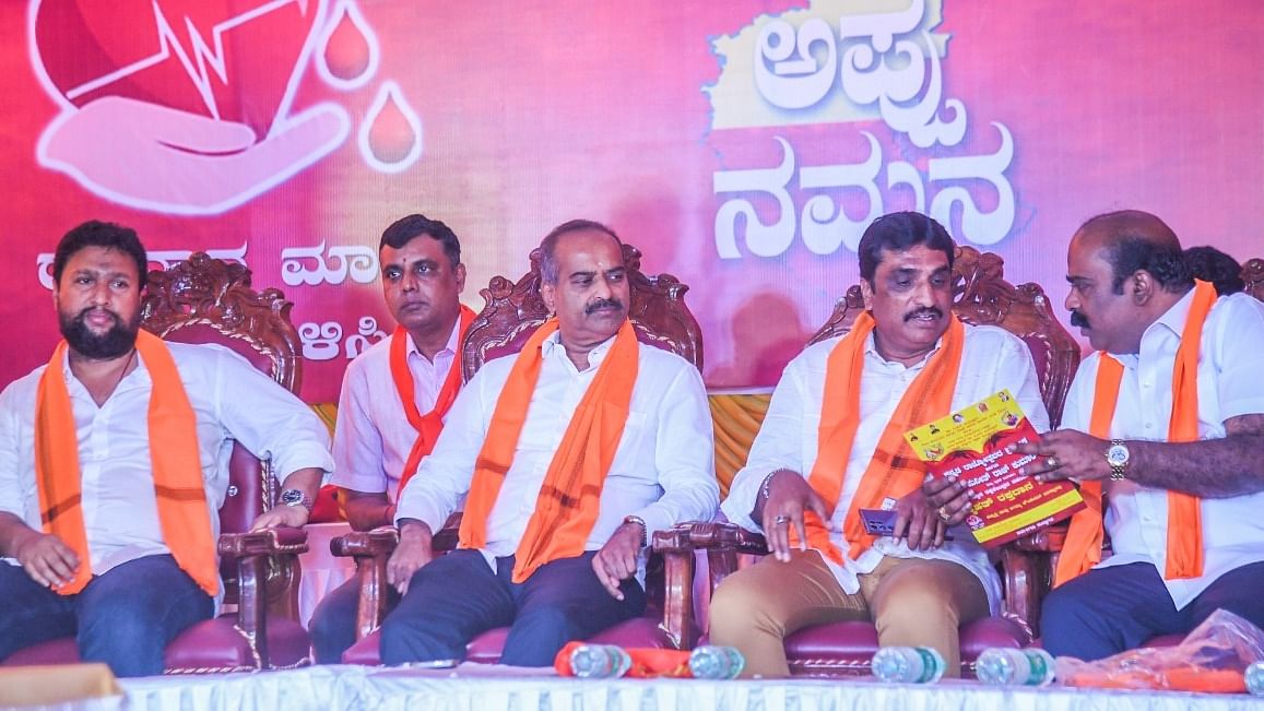 Rowdy-sheeter 'Silent' Sunila, Bangalore Central MP PC Mohan, Bengaluru South BJP president NR Ramesh and JD(S) leader Srikanth at the event in Chamarajpet on Sunday. Credit: DH Photo