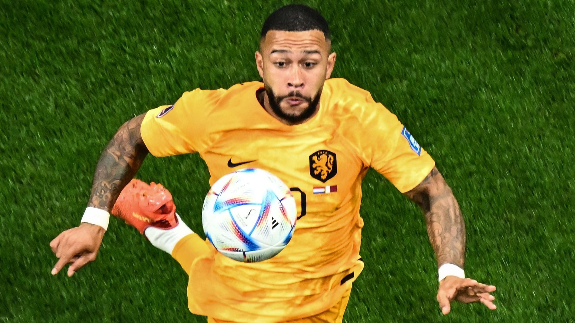 Netherlands' forward  Memphis Depay eyes the ball during the Qatar 2022 World Cup. Credit: AFP Photo