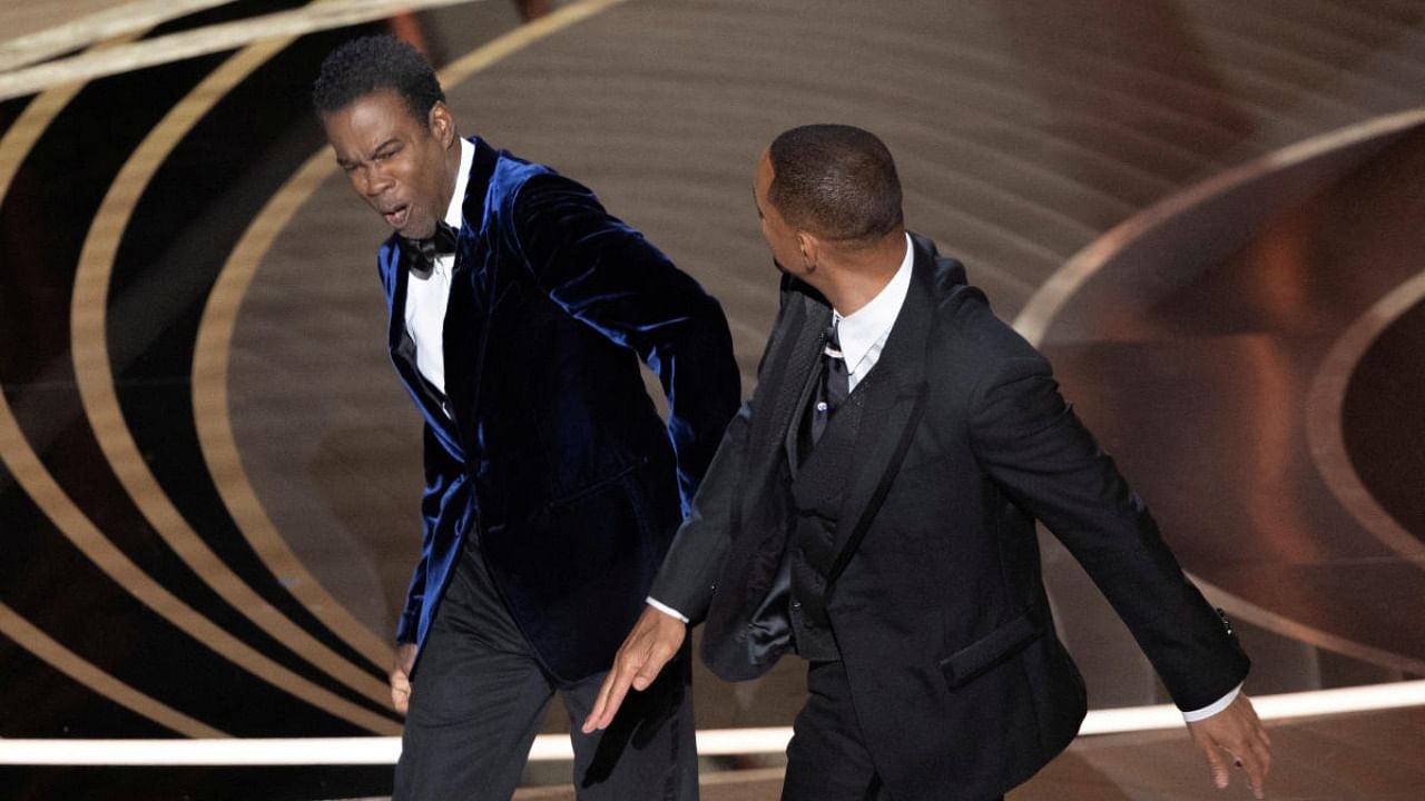 Will Smith (R) hits Chris Rock as Rock spoke on stage during the 94th Academy Awards in Hollywood, Los Angeles. Credit: Reuters file photo