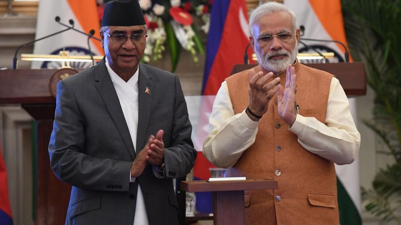 Indian Prime Minister Narendra Modi (R) and Nepali Prime Minister Sher Bahadur Deuba. Credit: AFP File Photo