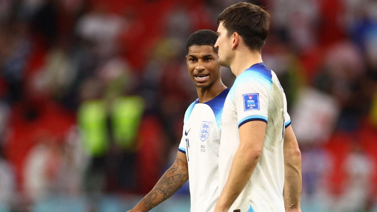 England's Marcus Rashford and Harry Maguire. Credit: AFP Photo