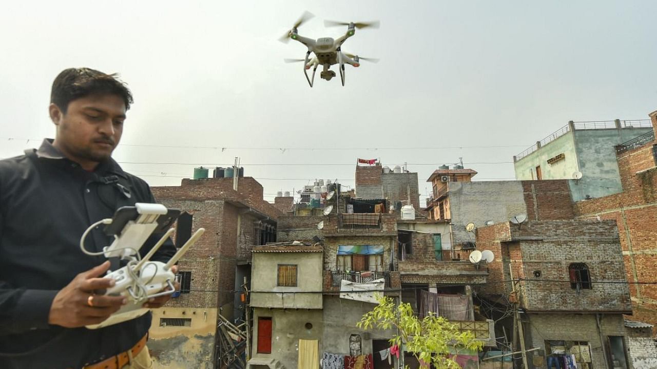 File photo of Delhi cops operating drone for surveillance over the riot-affected Jafrabad area of northeast Delhi. Credit: PTI Photo