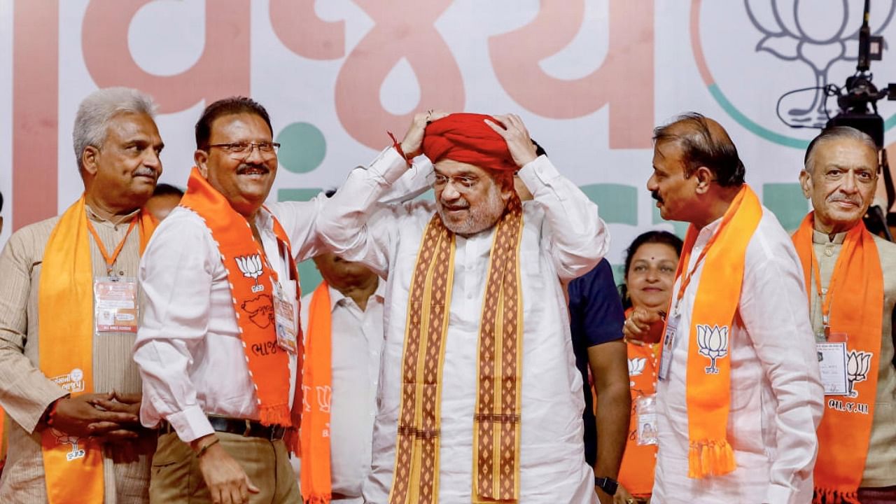 Amit Shah being felicitated during a public meeting ahead of Gujarat Assembly elections, in Ahmedabad. Credit: PTI Photo