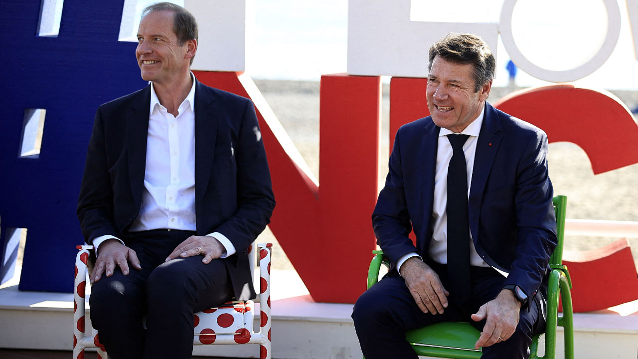 Tour de France general director Christian Prudhomme (L) and Mayor of Nice Christian Estrosi (R) pose on the Promenade des Anglais after the announcement that Nice will host the final stage of the 2024 Tour de France, on the french riviera city of Nice, on December 1, 2022. - For the first time since 1905, the Tour de France will not have its usual finish in Paris in 2024. Credit: AFP Photo