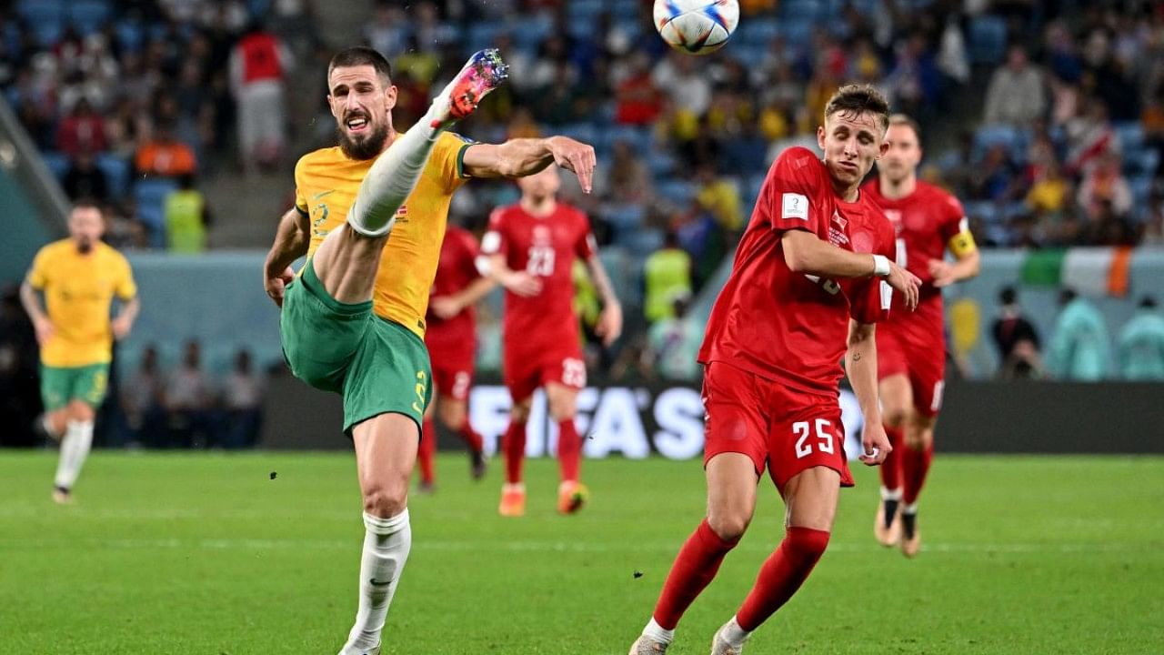 Australia's defender #02 Milos Degenek fights for the ball with Denmark's midfielder #25 Jesper Lindstrom. Credit: AFP Photo