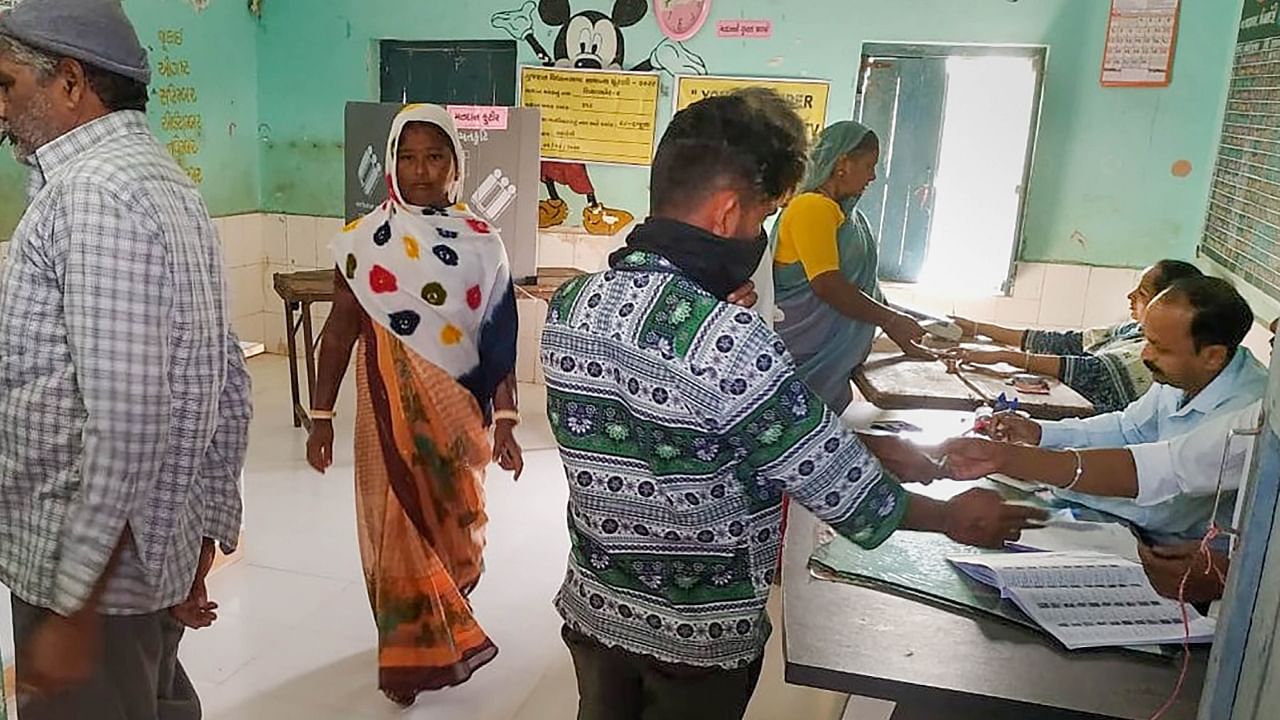 People cast their votes during the first phase of Gujarat Assembly elections, at Shiyalbet village in Amreli district, Thursday, Dec. 1, 2022. Credit: PTI Photo