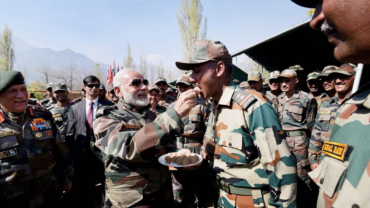 Prime Minister Narendra Modi celebrating the Diwali with the jawans of the Indian Army and BSF, in the Gurez Valley, near the Line of Control, in Jammu and Kashmir, October 19, 2017. Credit: PTI File Photo