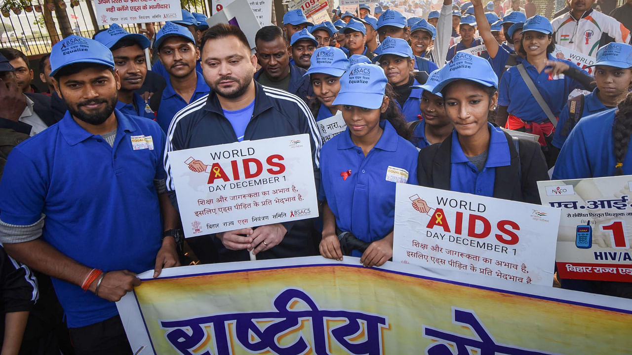 Bihar Deputy Chief Minister Tejashwi Yadav with volunteers participates in an AIDS awareness rally on World AIDS Day, in Patna. Credit: Credit: PTI Photo