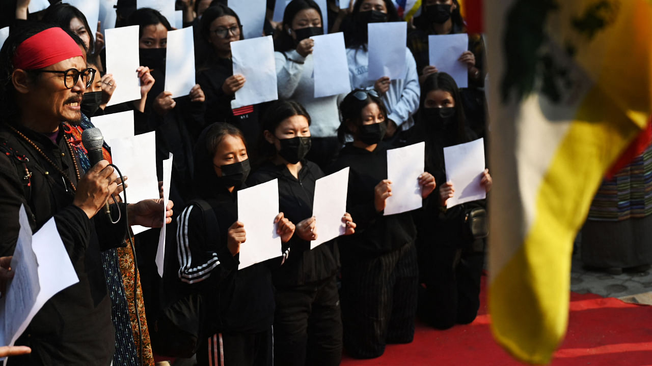 Activists of the Tibetan Youth Congress (TYC) hold blank papers during a protest in solidarity with the on-going "White Paper" protests in China. Credit: AFP Photo