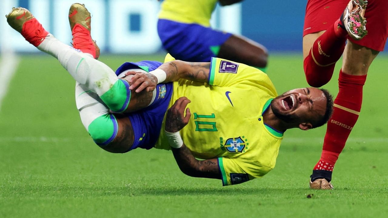Neymar reacts after a challenge from a Serbian player. Credit: Reuters Photo 