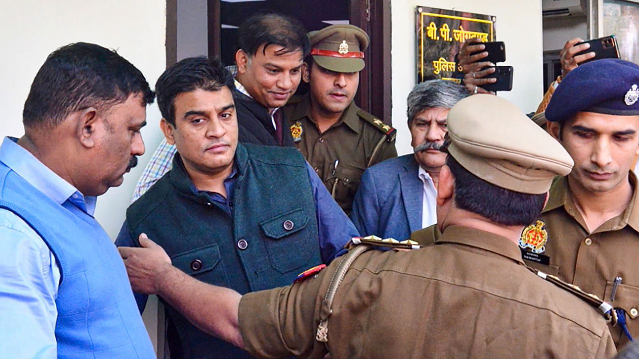 Samajwadi Party MLA Irfan Solanki and his brother Rizwan Solanki surrender at the Kanpur Police Commissioner Camp Office, in Kanpur. Credit: PTI Photo