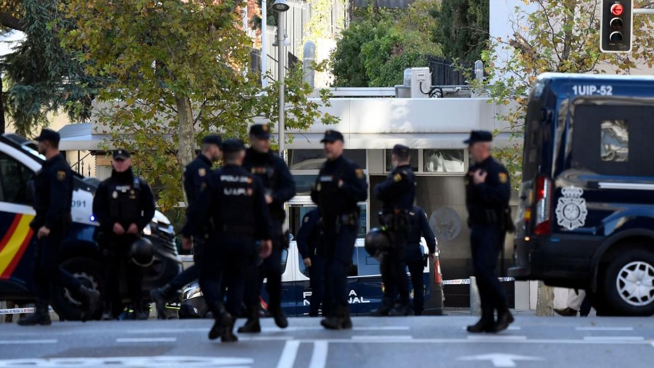 Spanish police stand guard near the US embassy in Madrid. Credit: AFP Photo
