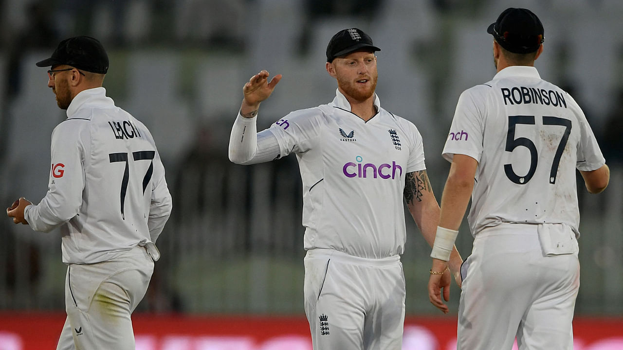 England's captain Ben Stokes (C) and teammates gesture as back to pavilion at the end of the third day of the first cricket Test match between Pakistan and England at the Rawalpindi Cricket Stadium, in Rawalpindi on December 3, 2022. Credit: AFP Photo