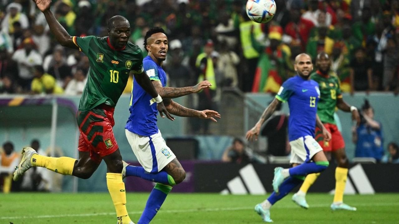 Cameroon's forward #10 Vincent Aboubakar (L) scores his team's first goal during the Qatar 2022 World Cup Group G football match between Cameroon and Brazil. Credit: AFP Photo