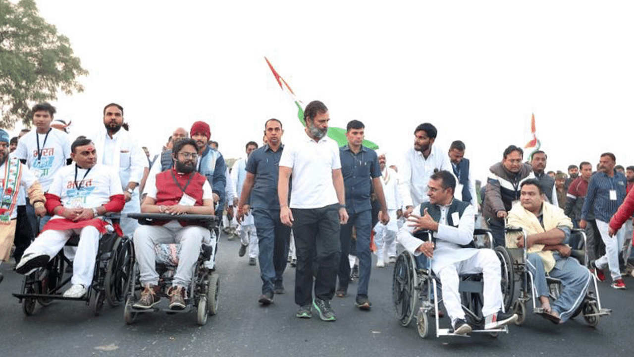 Congress leader Rahul Gandhi with differently-abled people on International Day of Persons with Disabilities during the party's 'Bharat Jodo Yatra', in Agar Malwa district. Credit: PTI Photo