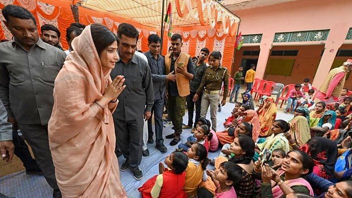 Samajwadi Party candidate Dimple Yadav interacts with locals while campaigning for the upcoming Mainpuri bye-election. Credit: PTI Photo