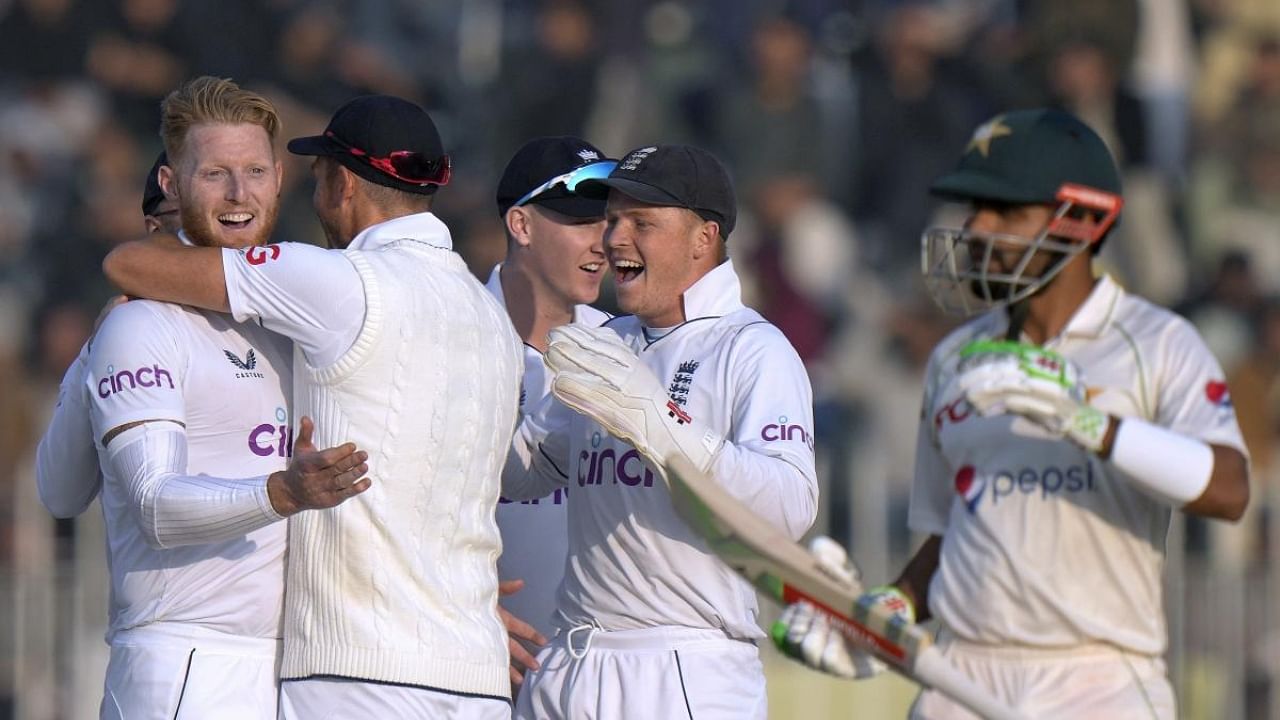 England's Ben Stokes celebrates with teammates after the dismissal of Pakistan Pakistan's Babar Azam. Credit: AP/PTI Photo