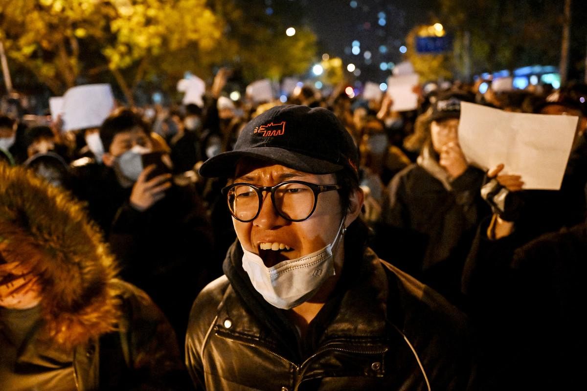 Protesters march in a rally against China's harsh Covid-19 restrictions, in Beijing. Credit: AFP Photo