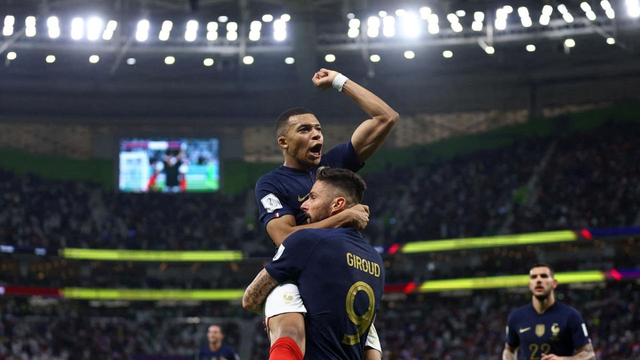 Olivier Giroud celebrates scoring their first goal with teammate Kylian Mbappe. Credit: Reuters Photo